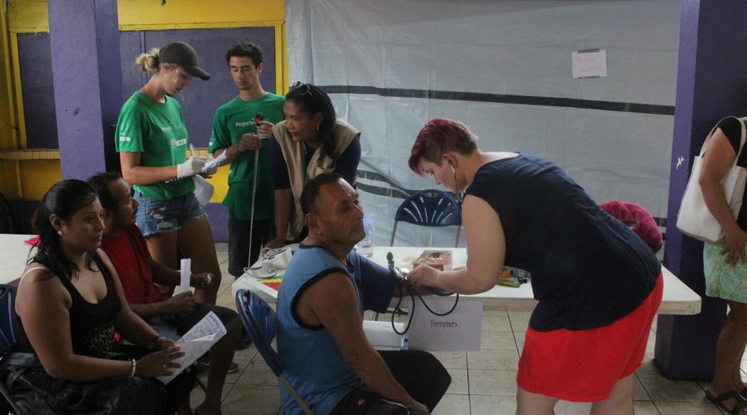 An intern with Projects Abroad measuring the blood sugar levels of a patient during her Public Health internship in Belize. Projects Abroad intern measuring blood sugar levels as part of her Public Health internship in Belize.